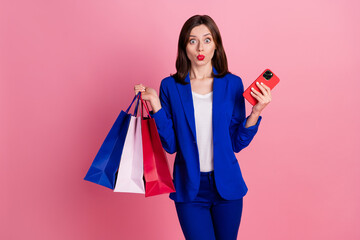 Poster - Photo of astonished pretty lady wear blue stylish suit wait order courier delivery service empty space isolated on pink color background