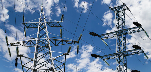 Wall Mural - Electricity pylon (high voltage power line) on the background of the cloudy sky