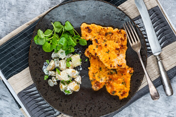 Canvas Print - Lemon and thyme pork schnitzel with potato salad