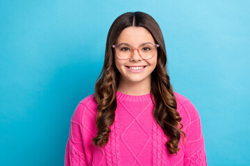 Canvas Print - Photo of young beautiful smart nerd schoolgirl academic wear eyeglasses satisfied lady smiling wear pink pullover isolated on blue color background