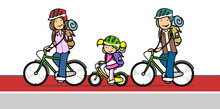 Family With A Child On A Bike Ride Rides A Bike On A Bike Path