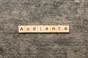 Wall Mural - AUDIENCE word written on wood block. AUDIENCE text on cement table for your desing, concept