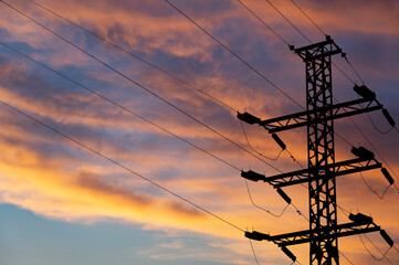 Wall Mural - Electricity pylon (high voltage power line), black contour,  against the background of a romantic evening sky