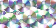 © Unleashed Design - Seamless scattered pile or stack of vintage compact discs (CDs, DVDs or CD-ROMs). Retro 90s and 2000s computer technology, music or film media concept backdrop or background pattern. 3D rendering.