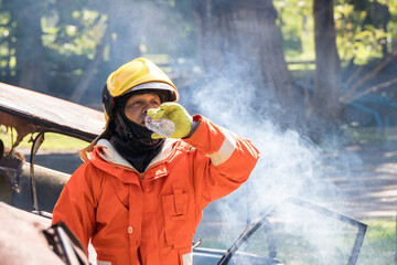 Wall Mural - Fireman rest and drinking water in work site.