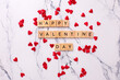 Romantic  layout. Wooden latters on  white marble background.  Top view. St. Valentines day postcard.