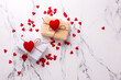 Romantic postcard.. Boxes with presents with hearts  on  white marble background.  Place for text. Top view. St. Valentines day, Mothers day postcard.