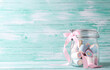 Glass jar full of colorful sweet marshmallows on turquoise wooden background. Place for text. St. Valentines day, Mothers day postcard.