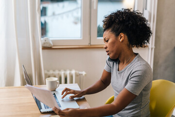 Wall Mural - Business woman talks with a client from home, remote work