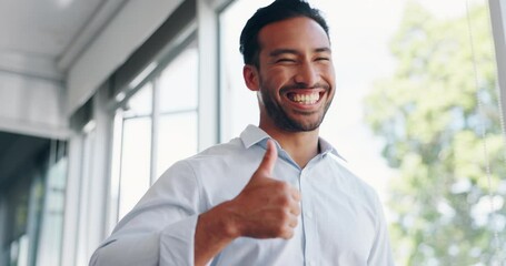 Wall Mural - Businessman, thumbs up and wink while walking in office for success, motivation or thank you. Face portrait, yes and male employee from Singapore with hand gesture for support, like emoji or approval