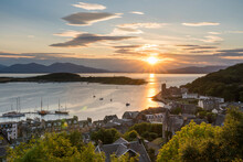The Sun Sets Over The Harbour Waters Of Oban, Scotland; Oban, Scotland