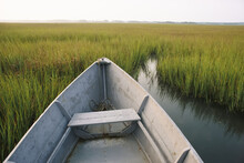 A Rowboat Rests In The Marsh Of Assateague Island.; Assateague Island, Virginia.