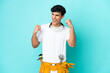 © luismolinero - Young electrician Argentinian man isolated on blue background celebrating a victory