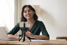 Cheerful Pretty Professional Influencer Woman Shooting Content For Blog On Smartphone Web Camera, Using Tripod, Gadget, Broadcasting Online, Smiling, Laughing, Speaking On Cellphone Screen