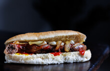 Close Up Of Boerewors Roll With Onions And Tomato Sauce