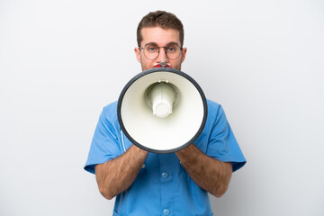 Poster - Young surgeon doctor caucasian man isolated on white background shouting through a megaphone