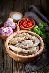 Wall Mural - Preparation for shrimp with garlic, red peppers and coriander