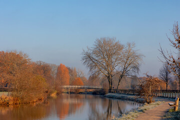 Wall Mural - Winter landscape view of white frost in morning, Nature path along the Kromme Rijn river (Crooked Rhine) in Rhijnauwen, Bunnik is a municipality and a village in the province of Utrecht Netherlands.