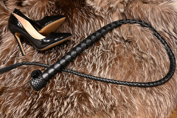 ハイヒールと鞭と毛皮　フェティッシュなイメージ　high heels and whip on a fur