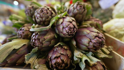 Fresh artichokes at farmers market. Closeup of organic food on display