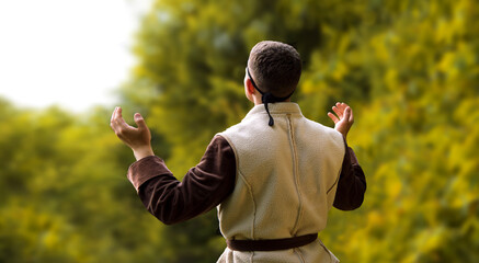 Praying man with raised hands