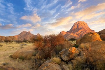 Wall Mural - Sunrise in calm morning in Spitzkoppe, panoramic, desert landscape of famous red, granite rocks, Namibia, Africa 