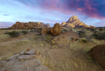 Wall Mural - Sunrise in calm morning in Spitzkoppe, panoramic, desert landscape of famous red, granite rocks, Namibia, Africa 