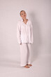 © Шамиль Алиев - Young girl in white house clothes on a white background in the studio