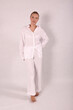 © Шамиль Алиев - Young girl in white house clothes on a white background in the studio