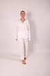 © Шамиль Алиев - Young girl in white house clothes on a white background in the studio