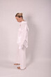 © Шамиль Алиев - Young girl in white house clothes on a white background in the studio
