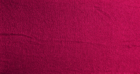 Wall Mural - Knitted background in crimson color. Knitted texture of woolen fabric.