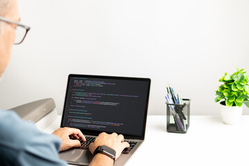 programmer coding, compiler, encode, debug, and developer application software for business corporate with laptop computer. Man programming coding web app from work at home, code show screen monitor
