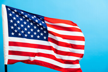 Wall Mural - American flag waving on blue background