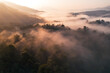 Sunrise in the forest,Aerial view of thick morning fog