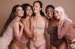 © N F/peopleimages.com - Diversity, women and body positive support in studio for body care wellness, beauty and skincare portrait. Interracial, group of people and cosmetics self care dermatology for models in underwear