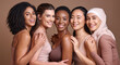 © N F/peopleimages.com - Skincare, diversity and women hug portrait for inclusivity, happiness and healthy skin texture. Interracial beauty and model group with woman in hijab smile for cosmetic campaign in brown studio