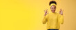 Count it done. Assured confident african-american woman in sweater headband show okay ok no worries gesture smiling self-assured plan goes fine, pleased good results, cheering yellow background