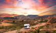 Motor home on the road at sunset- travel,  adventure,  road trip concept