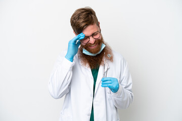 Wall Mural - Dentist reddish man holding tools isolated on white background laughing