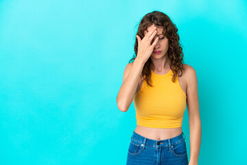 Wall Mural - Young woman with curly hair isolated on blue background with headache