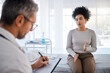 © K Davis/peopleimages.com - Healthcare, consulting and insurance with a black woman patient sitting in a hospital with her doctor. Medical, consultant and insurance with a female talking to a medicine professional for diagnosis