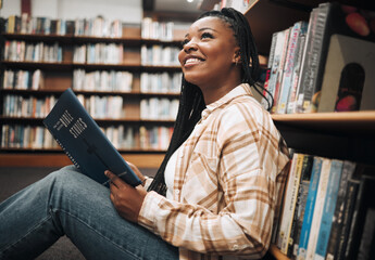 Poster - Black woman student, reading or library floor for religion, study or bible in research, focus or learning. African college student, christian education or studying god book for knowledge in Chicago
