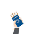 © NikahGeh - hand holding airplane ticket and passport