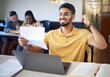 © K Abrahams/peopleimages.com - Man, student and excited with letter, laptop for typing and achievement for scholarship. Indian male, documentation with positive outcome and celebration for result, victory or approved application