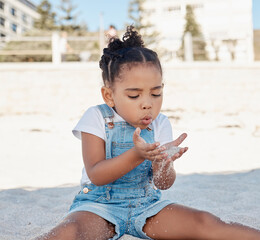 Wall Mural - Play, child or girl in sand at a beach for fun summer holidays, vacation or weekend alone relaxing with freedom. Travel, nature or young kid toddler playing on seashore outdoors in Sao Paulo, Brazil