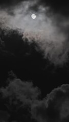 Wall Mural - full moon moving between clouds. vertical video