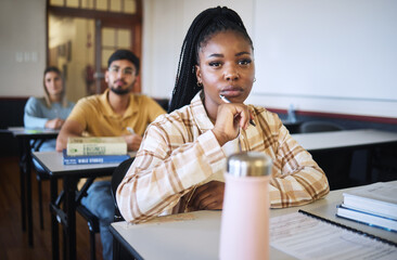 Poster - University, education and thinking with a student black woman in class during a lecture or lesson for learning. Study, school or scholarship with a female pupil sitting in a classroom for development