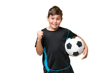 Wall Mural - Little caucasian football player kid over isolated chroma key background celebrating a victory in winner position