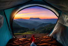 Woman Cross Leg On Blanket In Camping Tent With Sleeping Bags On Mountain Hill. View From Inside With Doi Luang Chiang Dao Mountains.